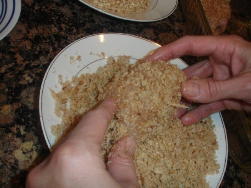 Rolling Chicken Cordon Bleu in Breadcrumbs