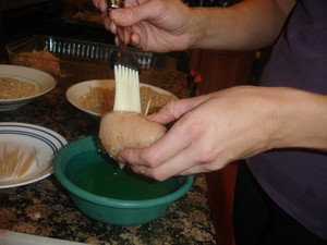 Brushing Chicken Cordon Bleu with oil